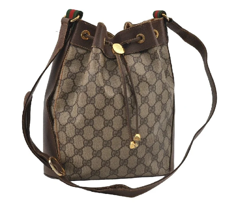 Women Gucci bags with a snap - button closure and a decorative charmAuthentic GUCCI Web Sherry Line Drawstring Bag GG PVC Leather Brown 1929I