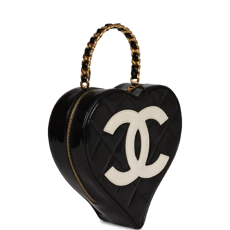 Chanel bags in luxury boutiques worldwideVintage Chanel Heart Vanity Bag Black and White Patent Antique Gold Hardware